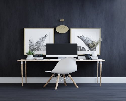 Black and white photo of a 1920s medical office with books